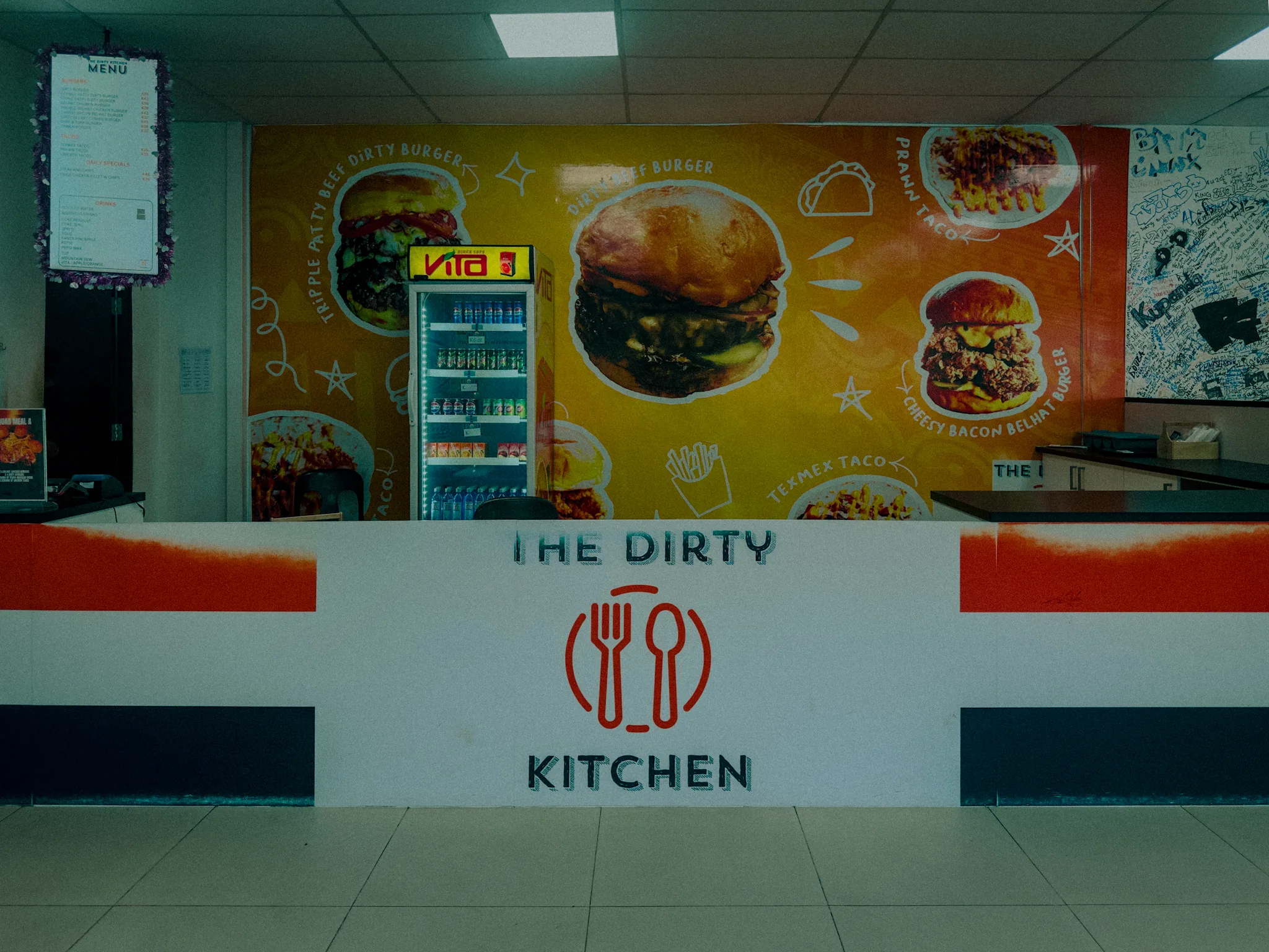 The Dirty Kitchen counter and branded menu wall